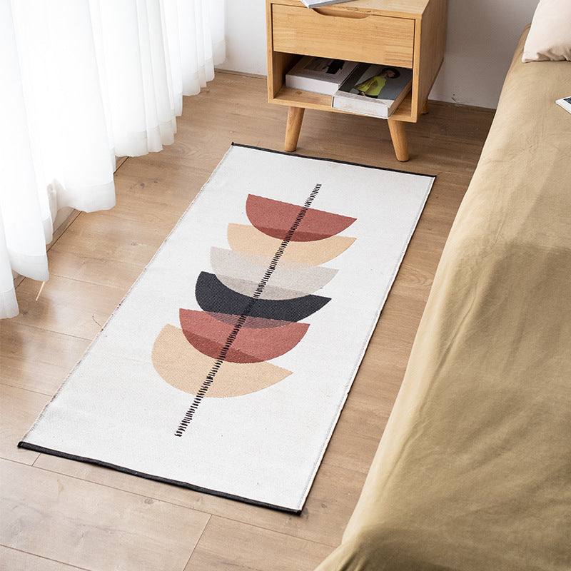 Flat-woven kitchen runner with modern striped pattern and easy-care cotton blend