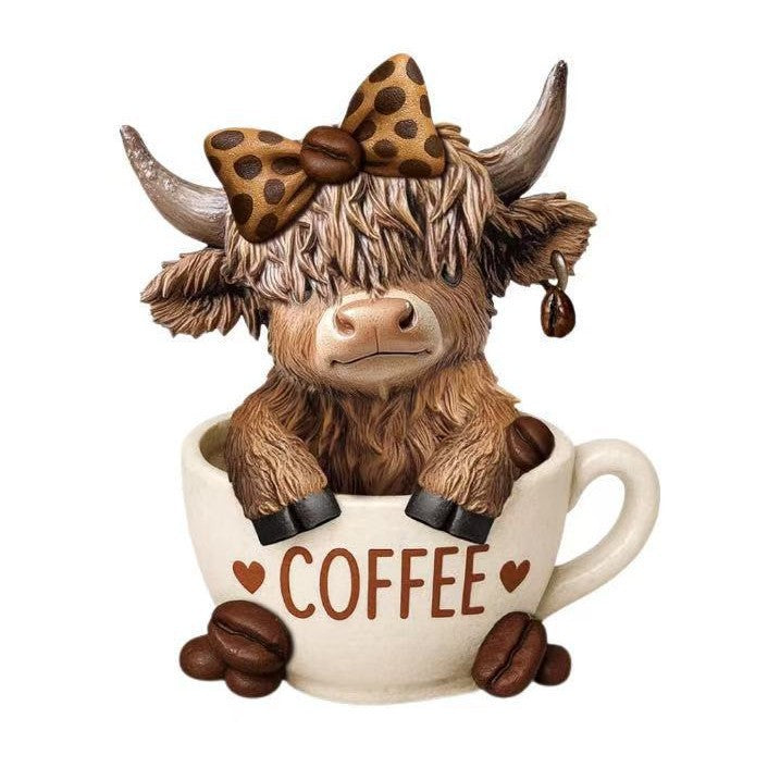 Decorative figure of a Highland cow with accessories