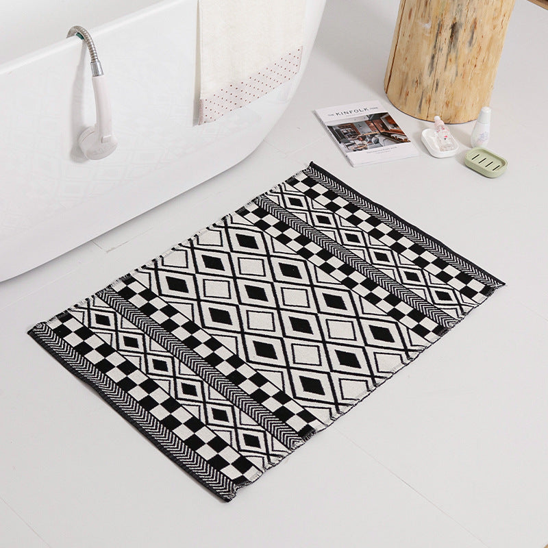 Flat-woven kitchen runner with non-slip underside and geometric diamond pattern