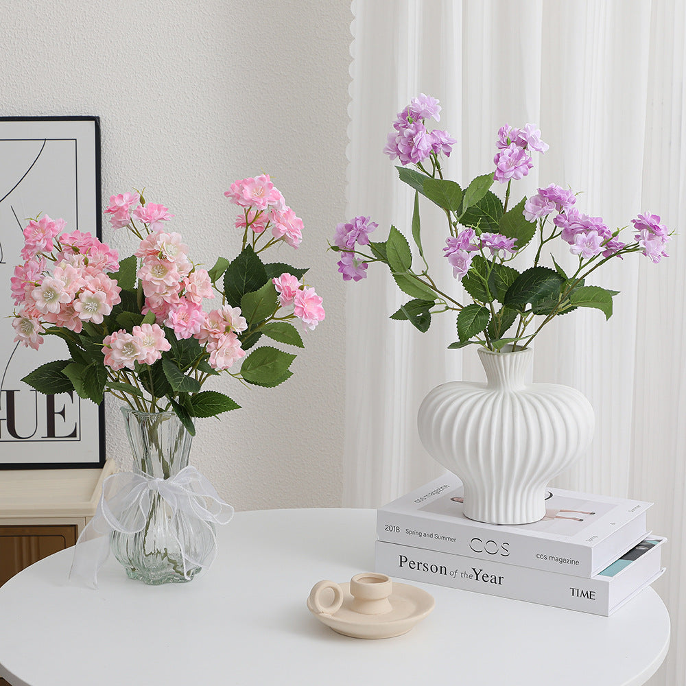 Artificial flower arrangement with delicate white blooms