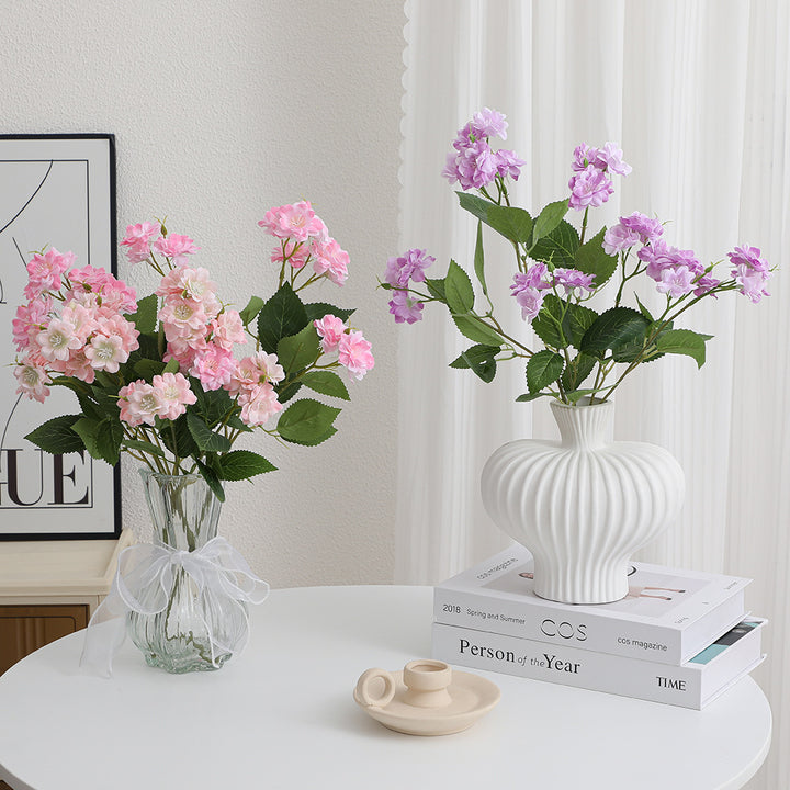 Artificial flower arrangement with delicate white blooms