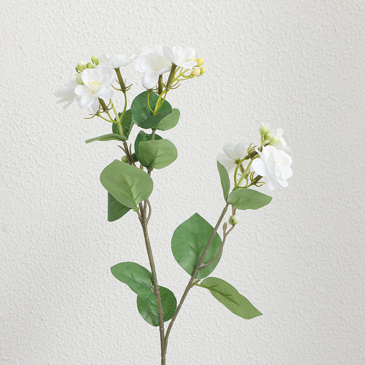 Artificial flower branch with vibrant pink flowers