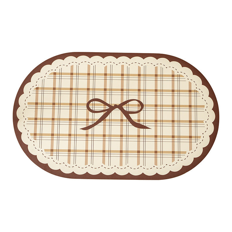 Rectangular table set placemat made of coated cotton mix with check pattern, decorative edge and bow motif