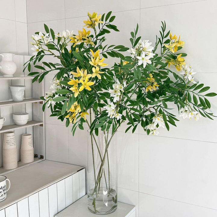 Decorative artificial flower branch with delicate flowers