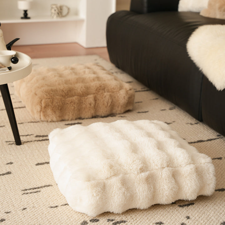 Plush floor cushion pouf with padded filling and faux fur cover
