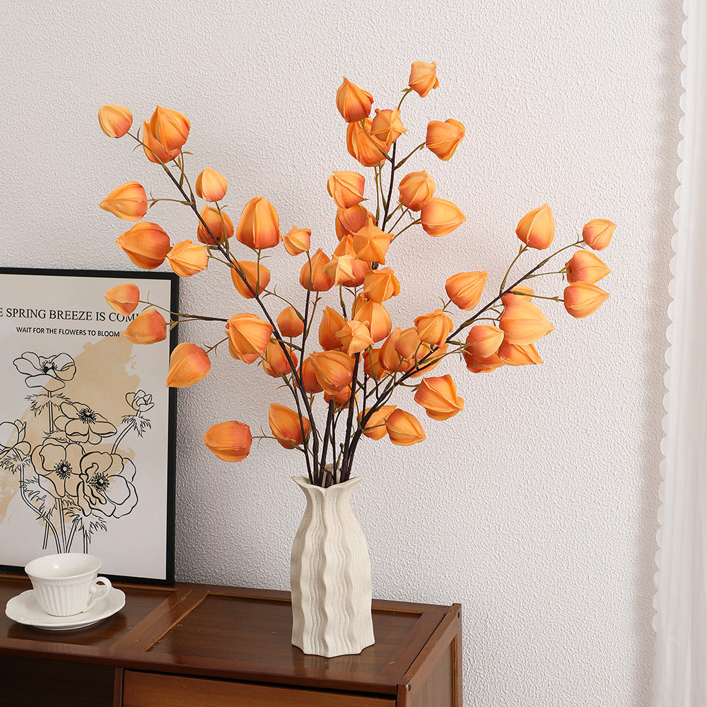 Artificial flower branch with vibrant flowers