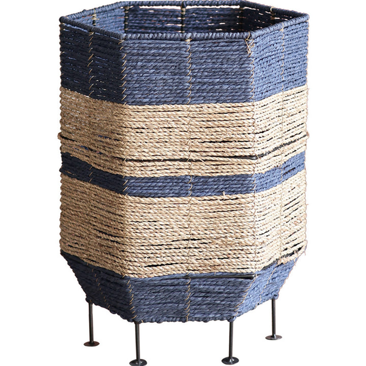 Stylish laundry basket made of rattan with metal legs