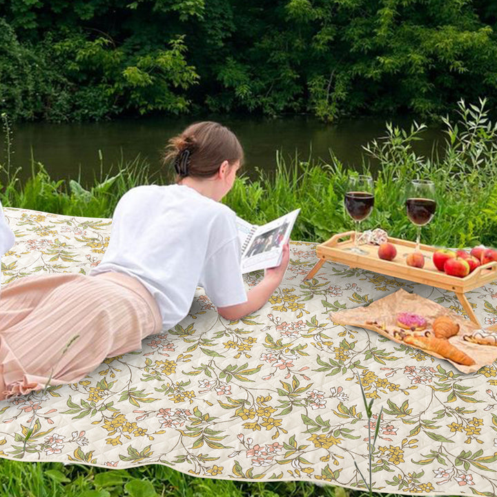 Quilted picnic and beach blanket set with carrying strap and water-repellent back