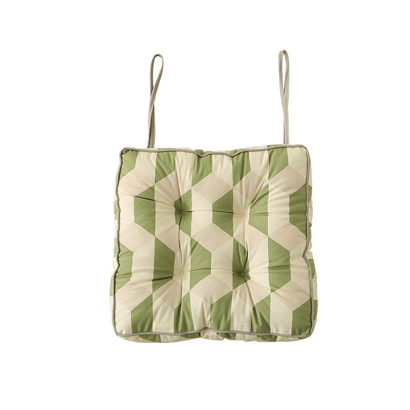 Padded chair cushion with ties and tufted seat