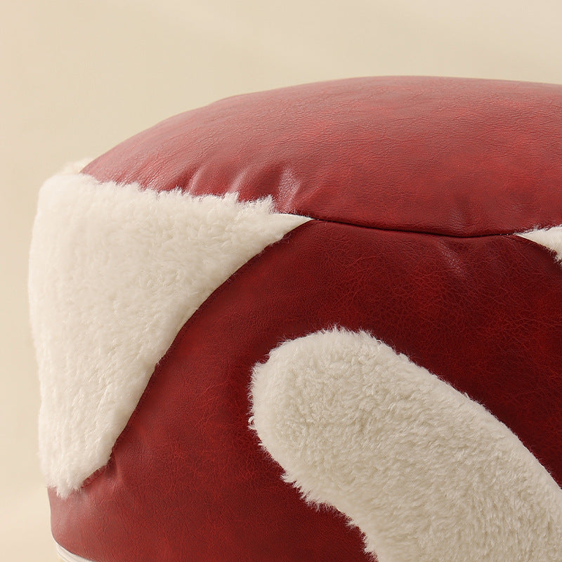 Round padded seat pouf as a floor stool with vintage leather look and teddy fleece inserts