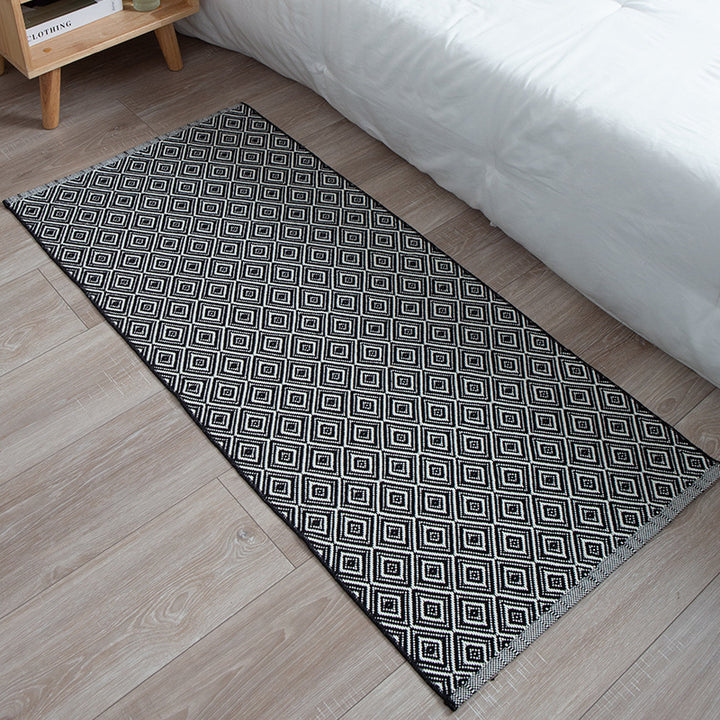 Flat-woven runner rug with check pattern and decorative border stripe