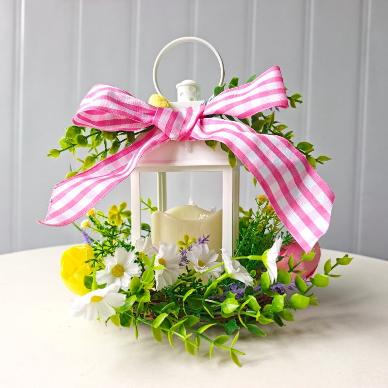 Decorative table lantern with artificial flowers and ribbon