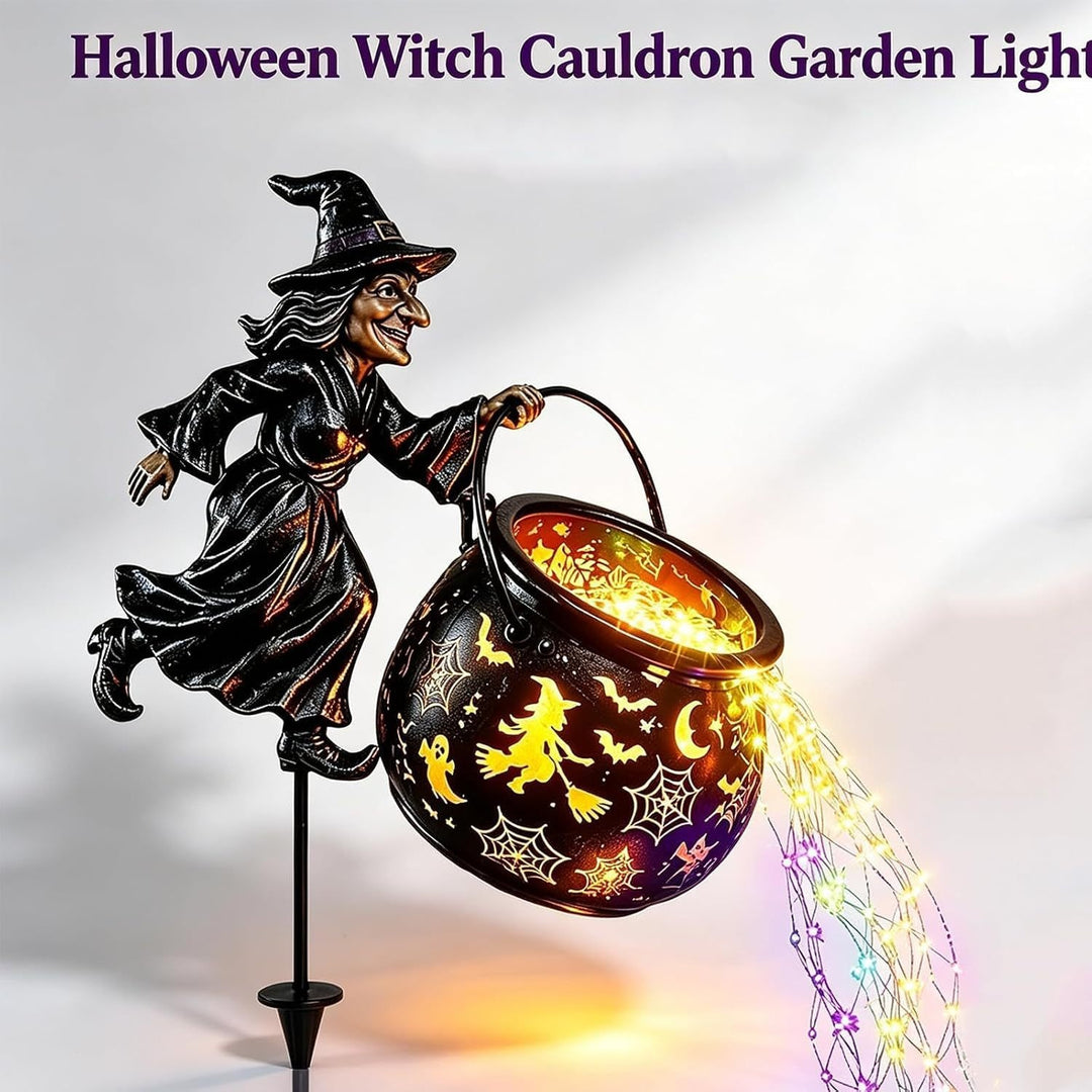Garden decoration with illuminated witch figure
