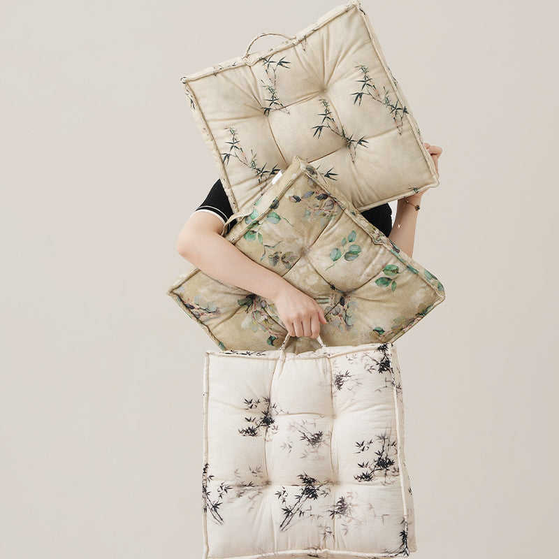 Padded square seat cushion with tufted stitching and fine bamboo print