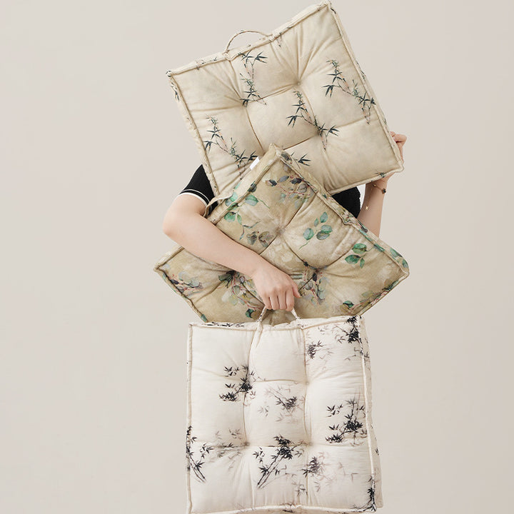 Padded square seat cushion with tufted stitching and fine bamboo print