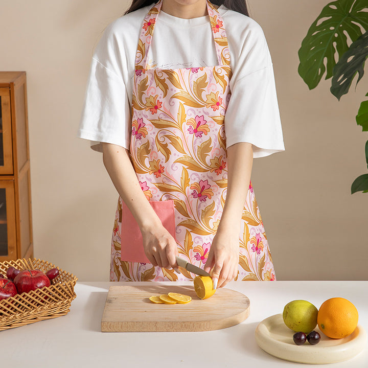 Cotton apron with floral pattern, adjustable neck strap and front pocket