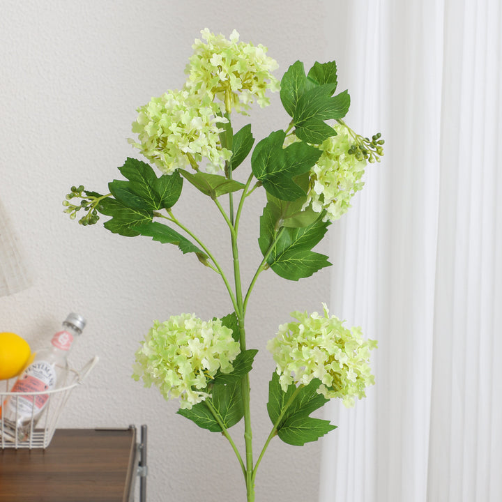 Artificial hydrangea branch with vibrant flowers and detailed leaves