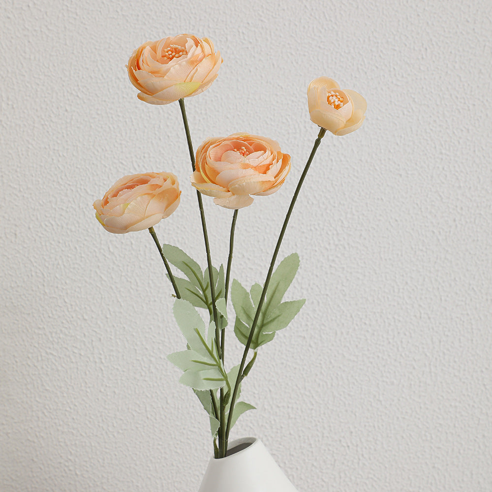Decorative artificial flower bouquet with intricately detailed ranunculus