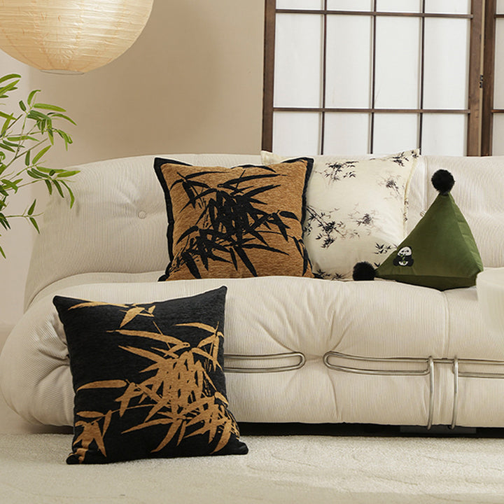 Decorative velvet cushion with embroidered bamboo motif and piping