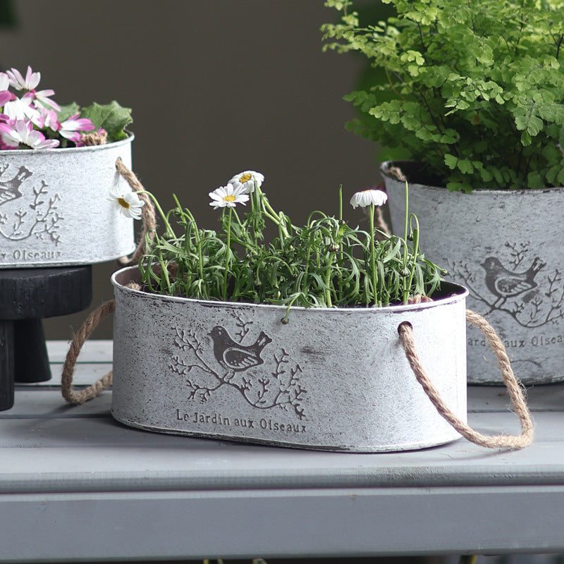 Decorative storage basket made of metal with natural design