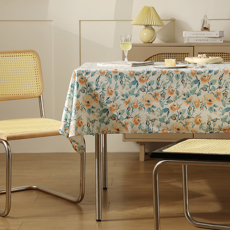 Wipeable tablecloth made of polyester with floral watercolor look and water-repellent coating