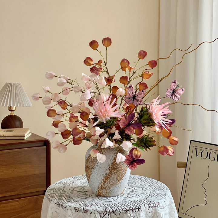 Elegant Floral Arrangement with Decorative Butterflies