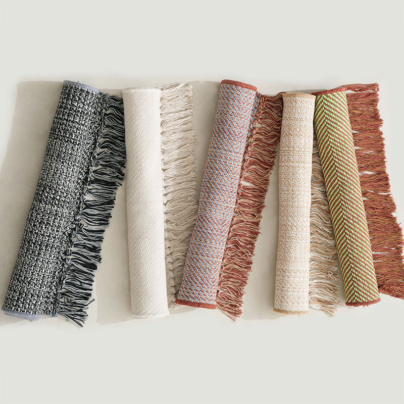 Woven table runner with dense herringbone jacquard and fringes