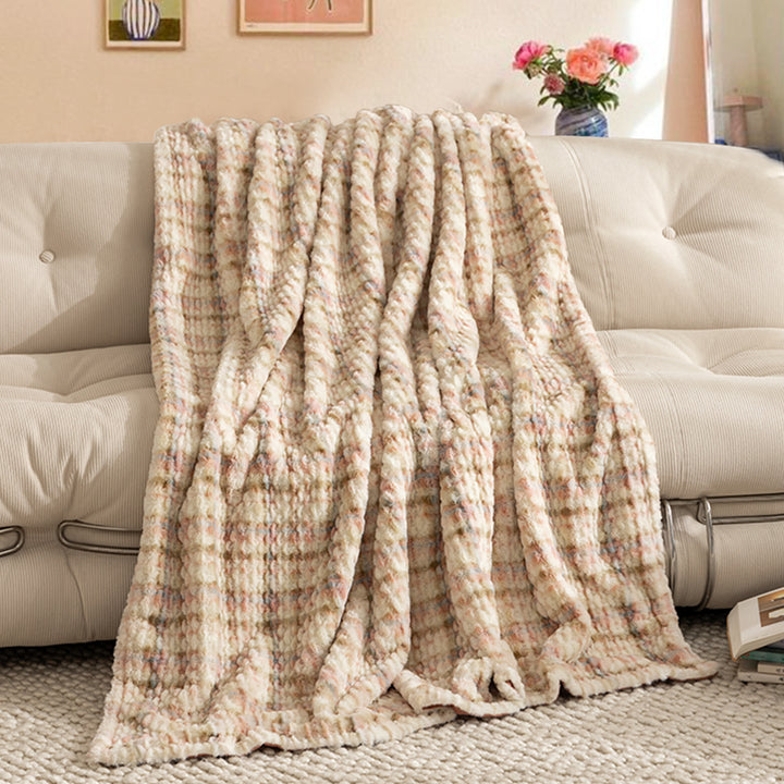 Cozy blanket made of luxurious synthetic fur with wavy texture and soft microfiber back