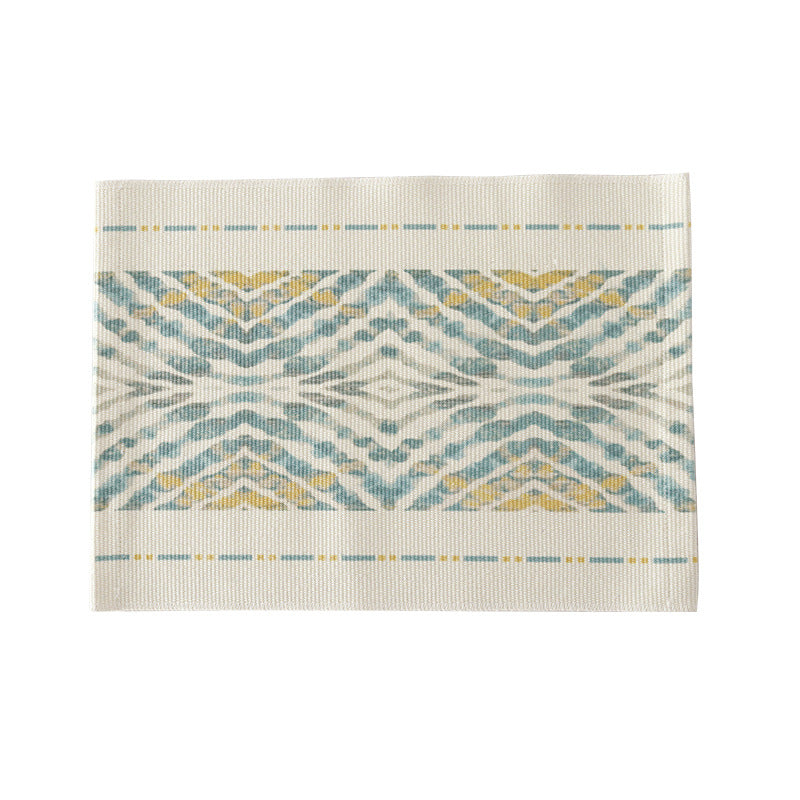 Woven placemat made of cotton blend with geometric diamond trim and fine texture