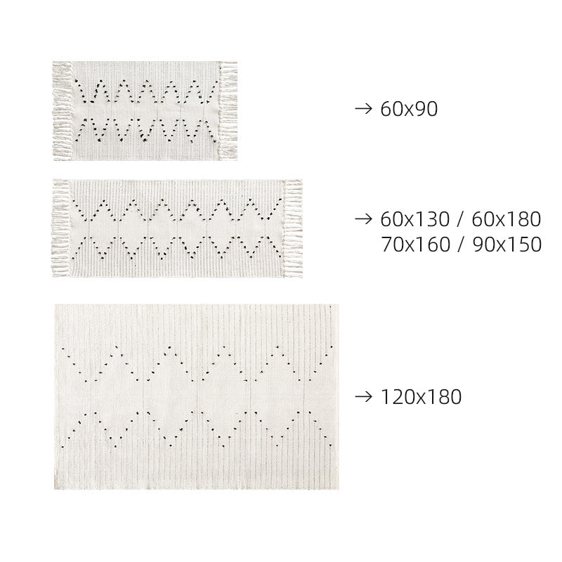 handwoven living room rug with fringes and geometric perforated pattern