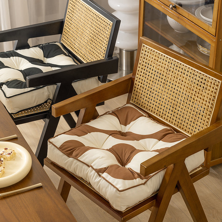 Padded chair cushion with ties and tufted seat
