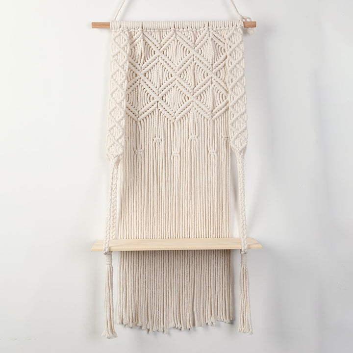 Macramé wall shelf with integrated plant holder