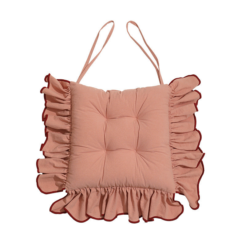 Padded chair cushion with ruffle and ties