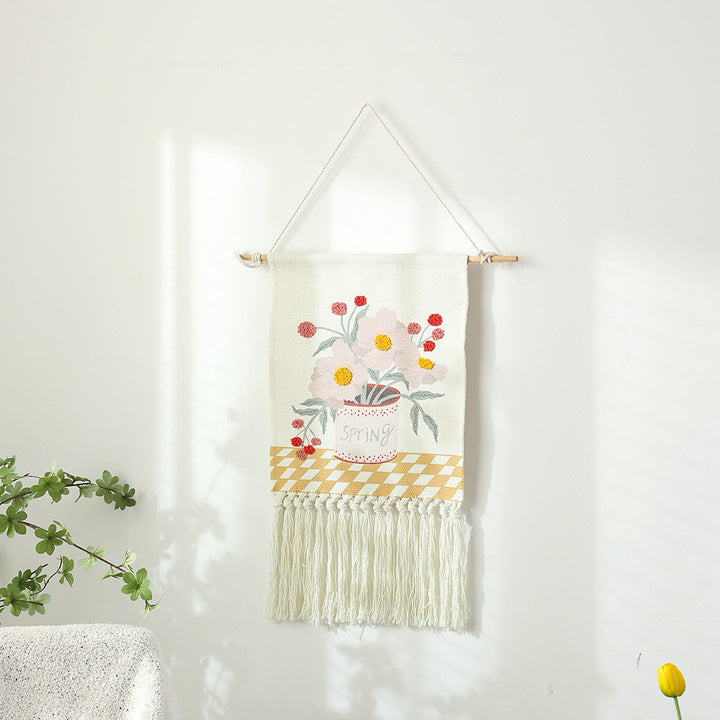 Woven cotton wall hanging with punch needle flower relief and fringes