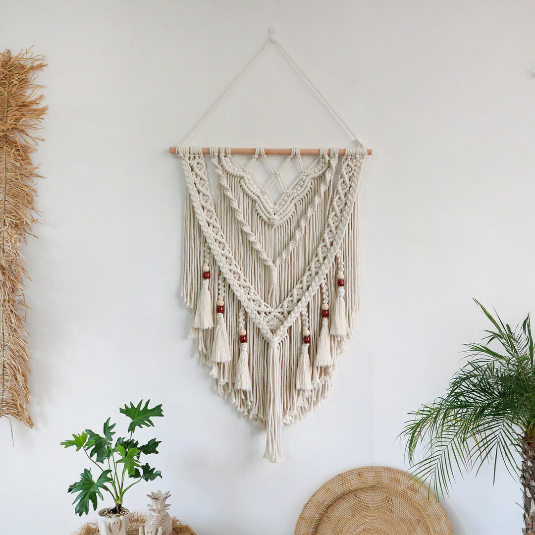Hand-woven macrame wall hanging with decorative tassels