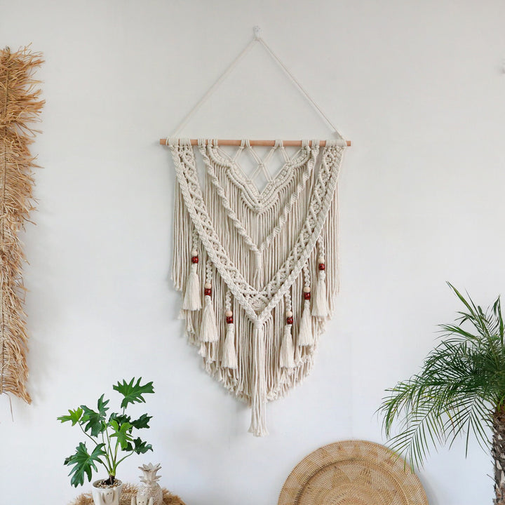 Hand-woven macrame wall hanging with decorative tassels