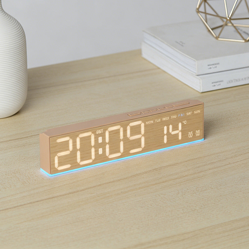 Digital alarm clock with temperature sensor and week display