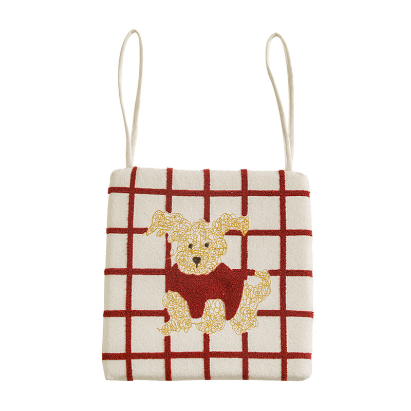 Square seat cushion with appliquéd dog motif, padded filling and attachment straps