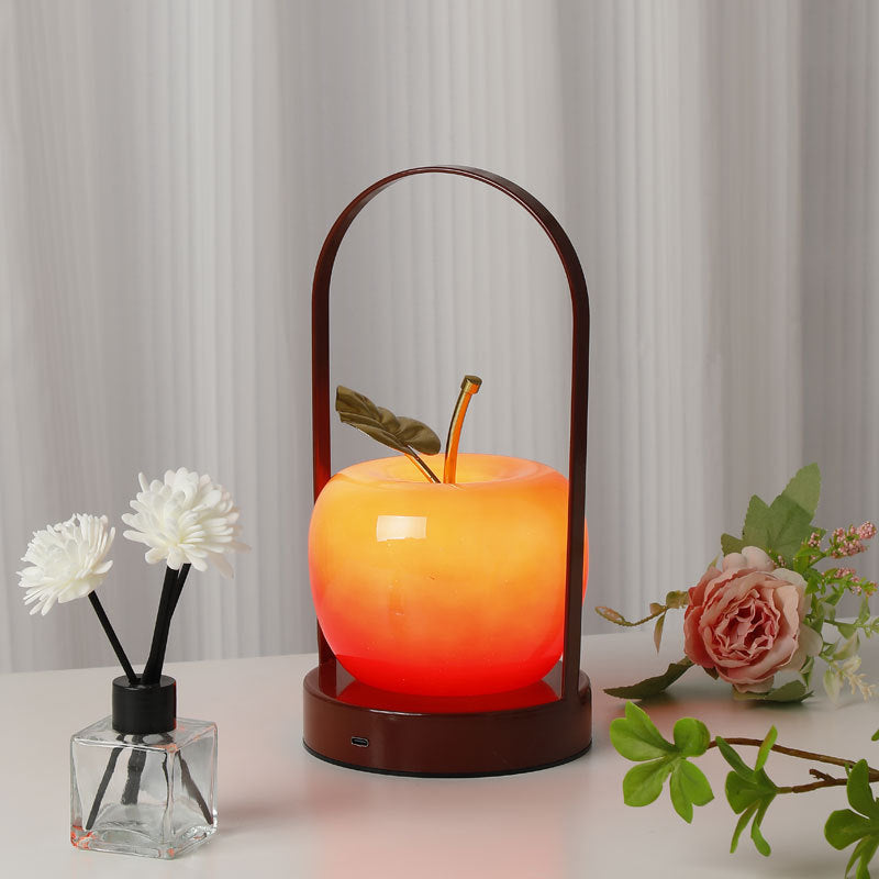Ceramic apple-shaped ambient table lamp with brass handle