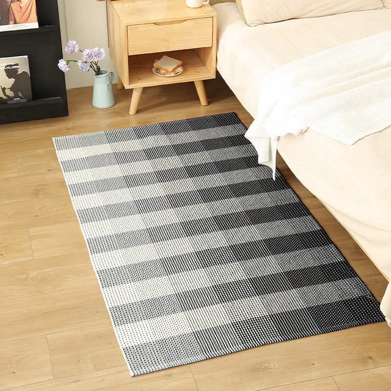 Modern flat-weave area rug with contrasting stripes and non-slip underside