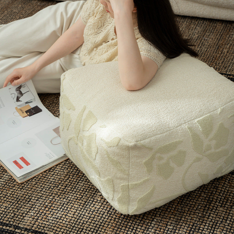 square pouf with bouclé cover and textured jacquard pattern