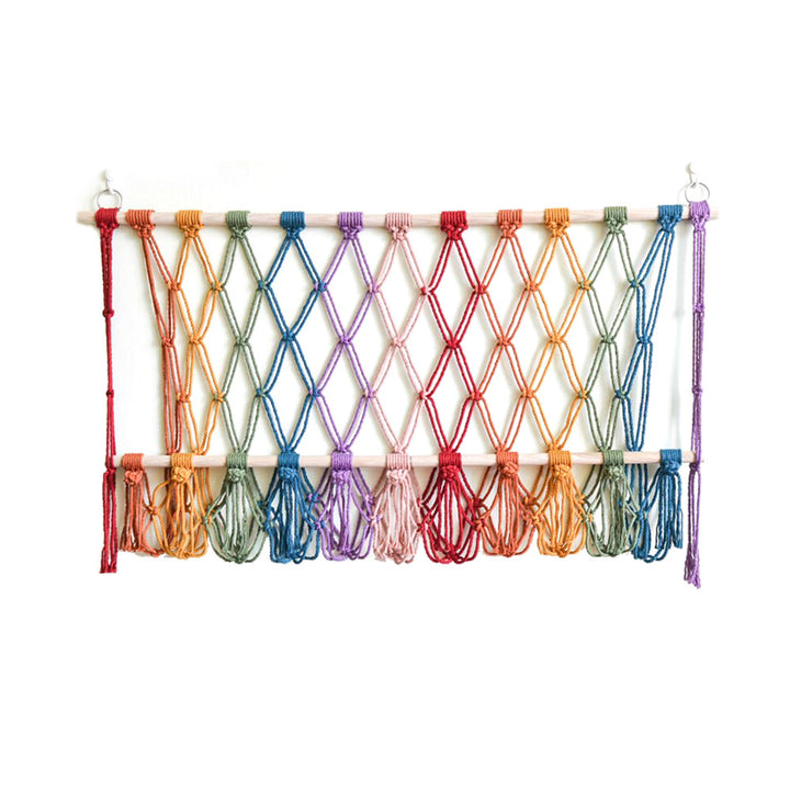 Elegant macramé wall hanging with decorative tassels and wooden frame