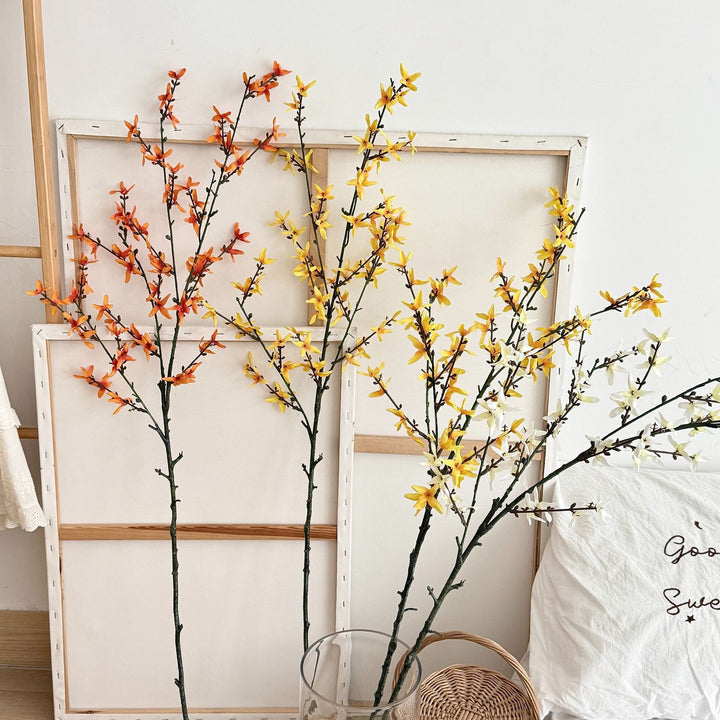 Artificial flower branch with intricately detailed yellow flowers