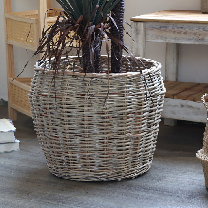 Stylish laundry basket made of braided natural material