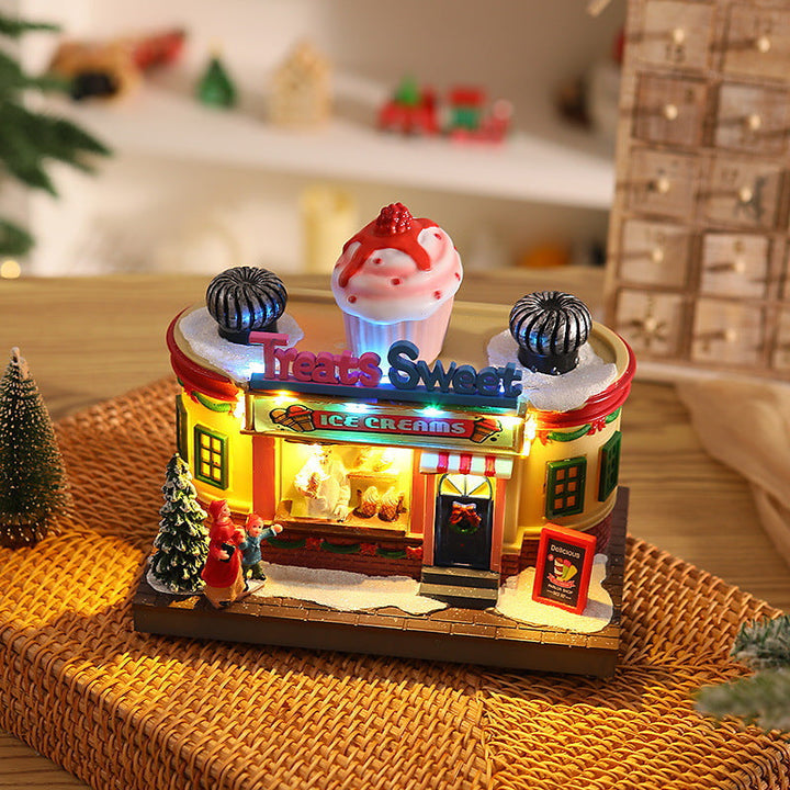 Illuminated Christmas village decoration with moving figures