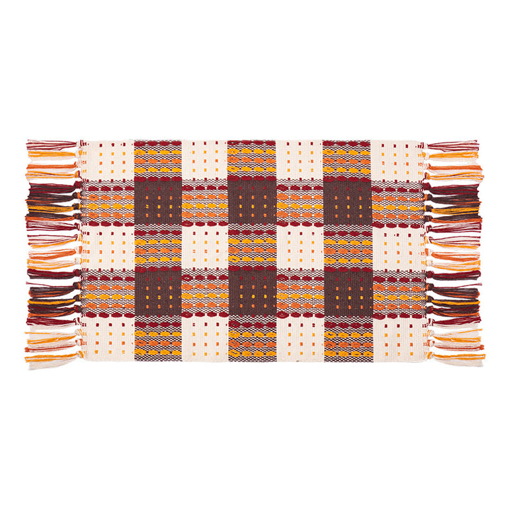 Woven colorful table runner with fringes and checkered structure