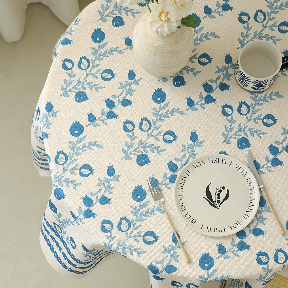 Cotton blend tablecloth with woven floral border decor and green hem
