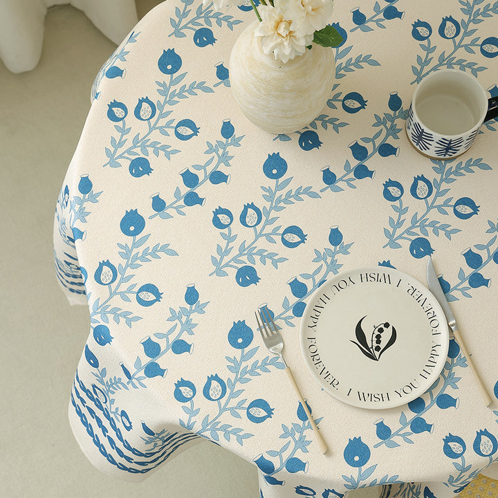 Cotton blend tablecloth with woven floral border decor and green hem
