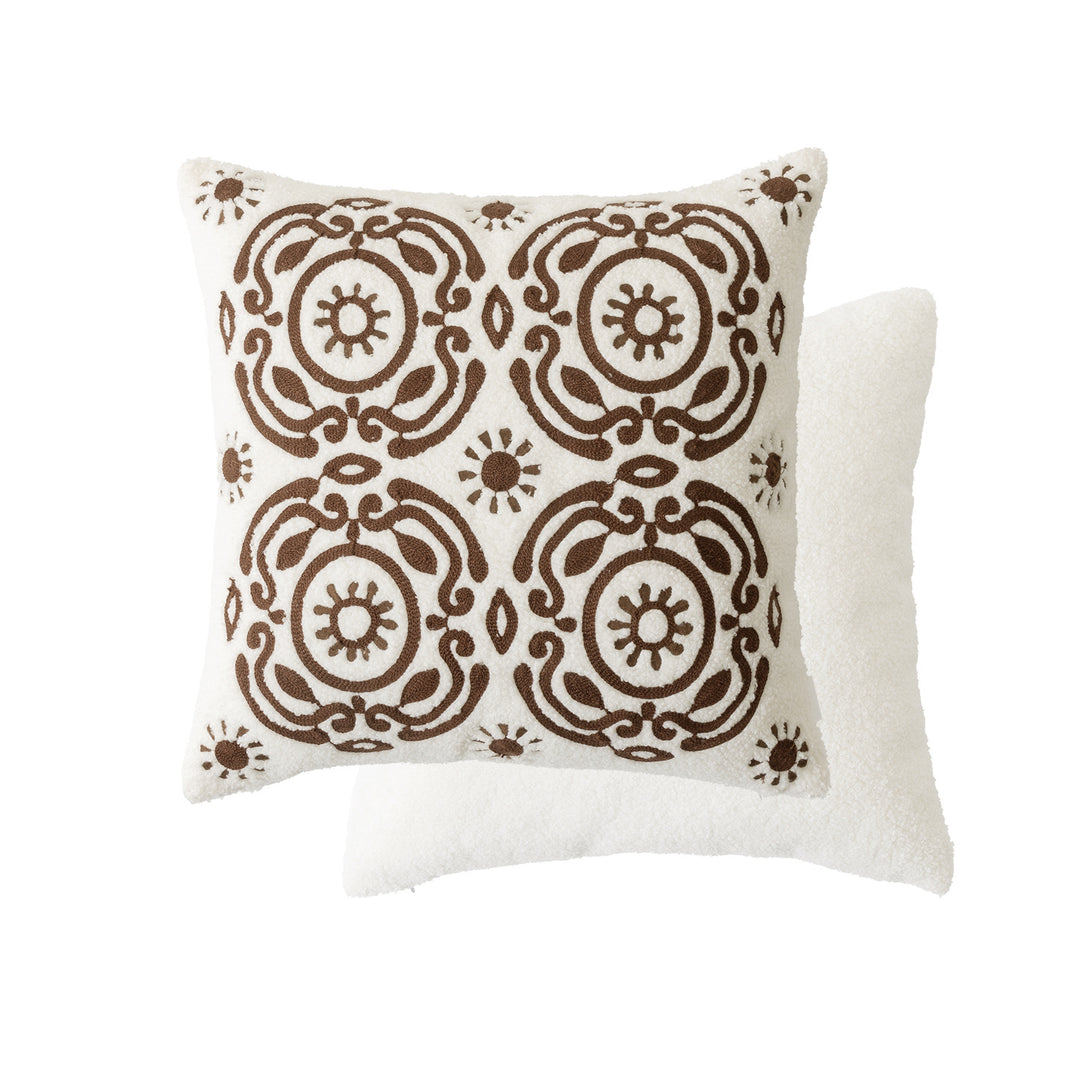 Bouclé pillow with hand-stitched ethnic design and removable cover