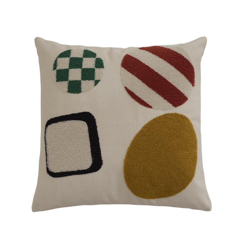 Square cushion cover with hand-tufted geometric applications